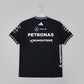 Black sports jersey with Petronas and CrowdStrike logos on a green background