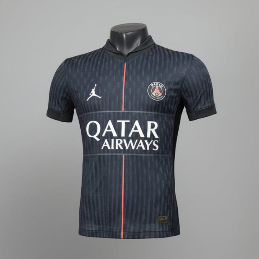 Soccer jersey with brand logos on a mannequin against a gray background