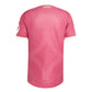A pink short-sleeve athletic jersey shown from the back, featuring a subtle geometric pattern and a white RMCP logo printed at the top collar, set against a light gray background.