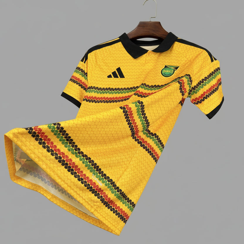 Yellow sports jersey with Adidas logo on a hanger against a black mesh background