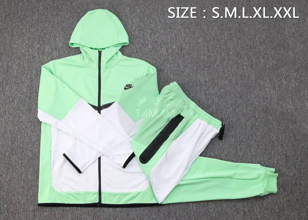 Nike tracksuit green and white hotsell